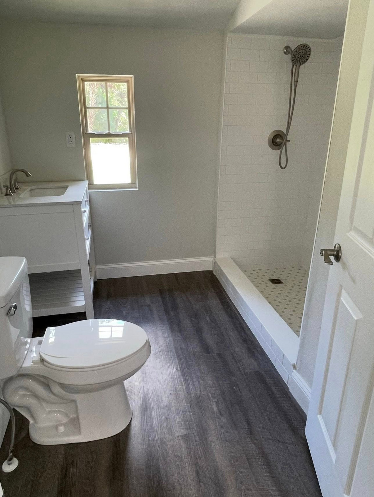 Full bathroom remodel with subway tile walk-in shower