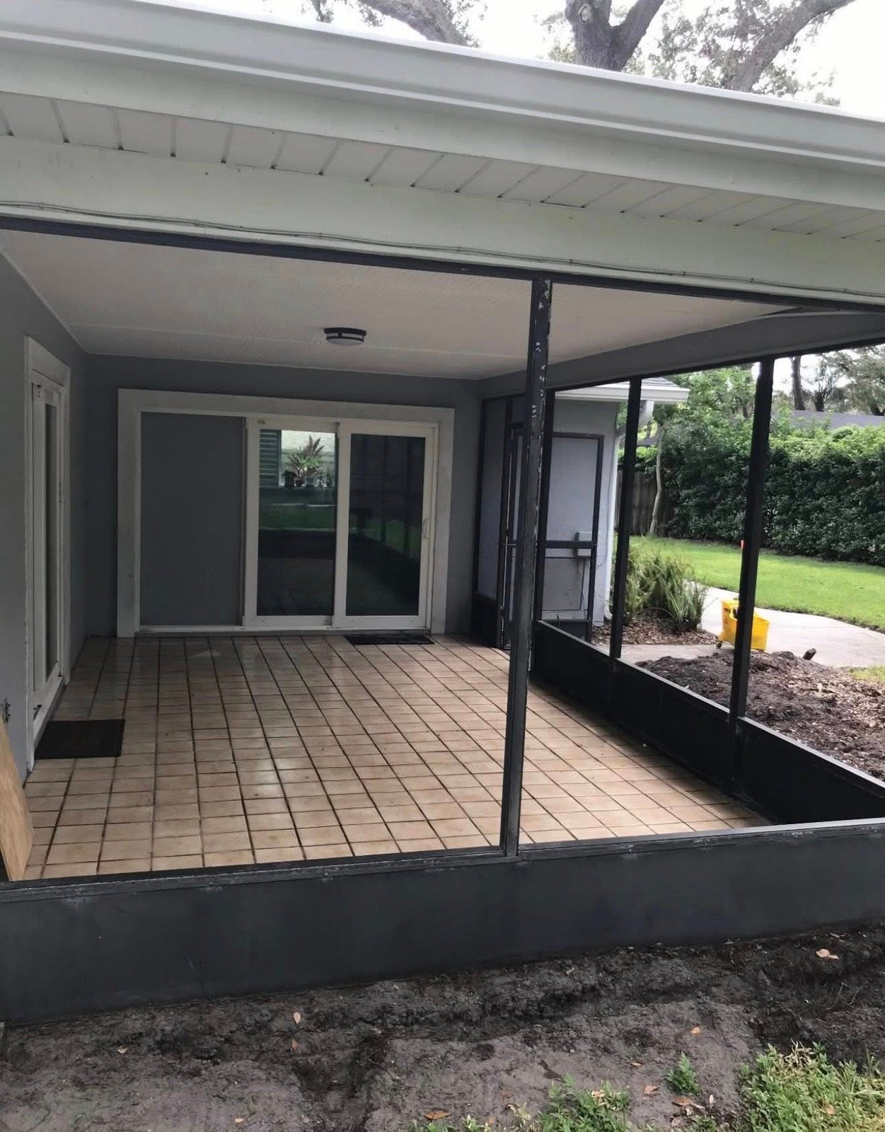 Screened patio enclosure before conversion