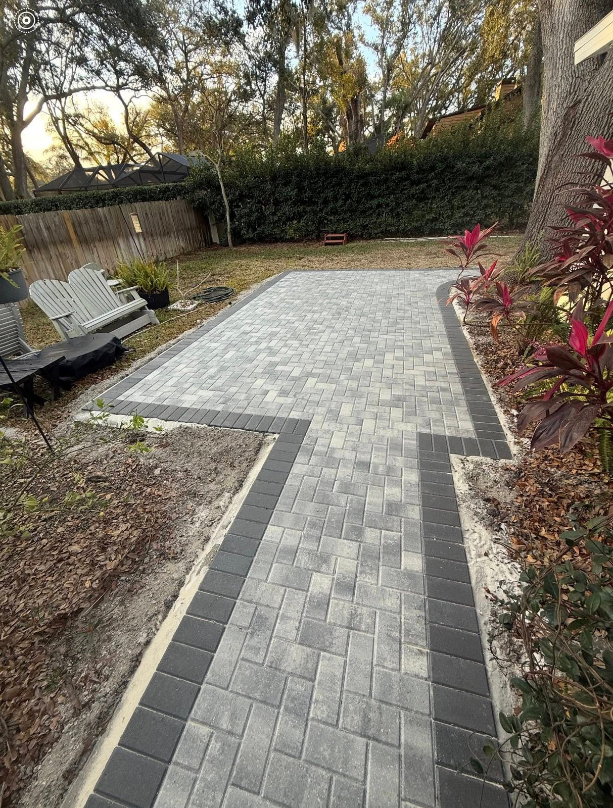 New brick paver patio with charcoal border