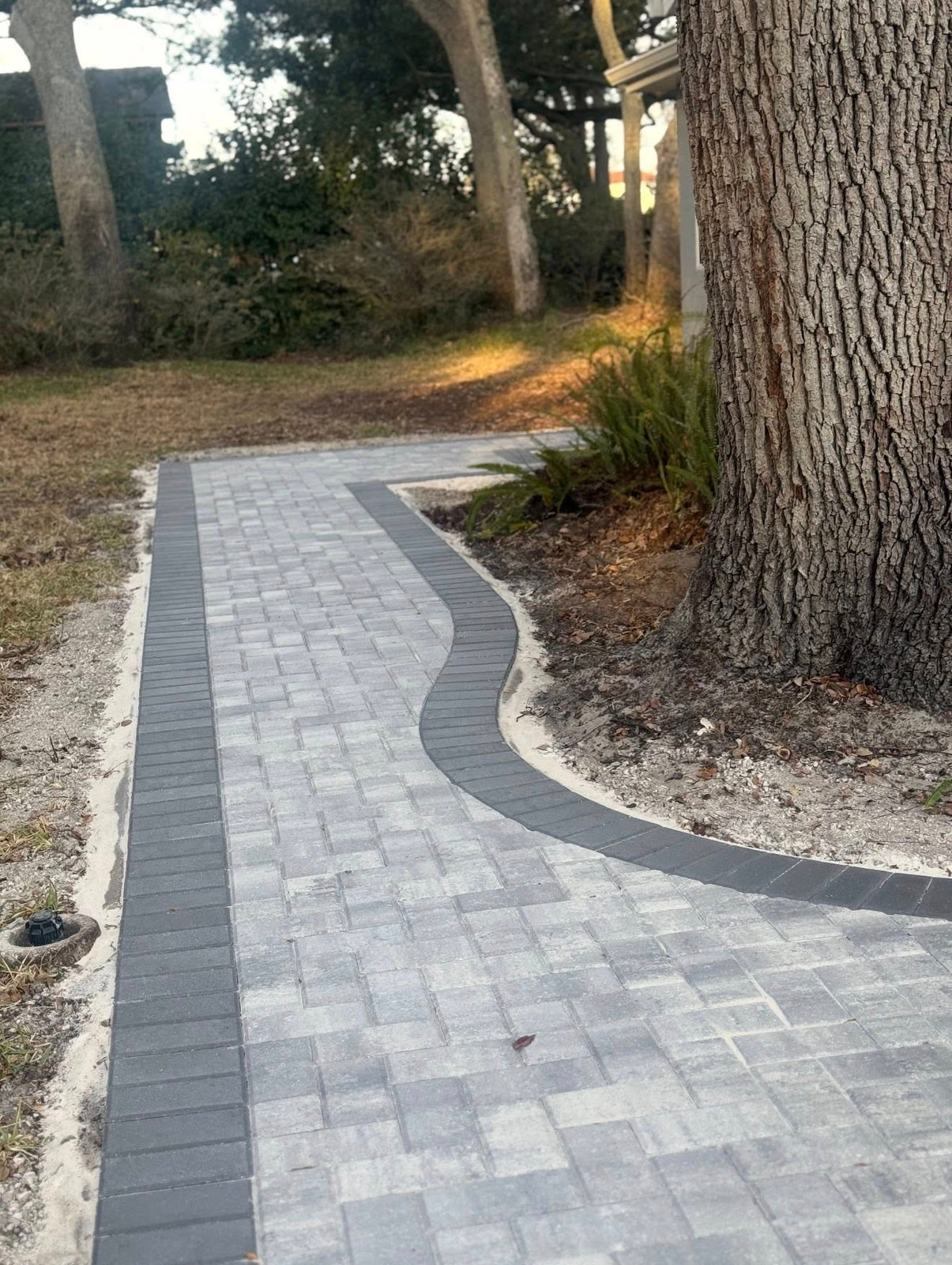Curved brick paver walkway installation