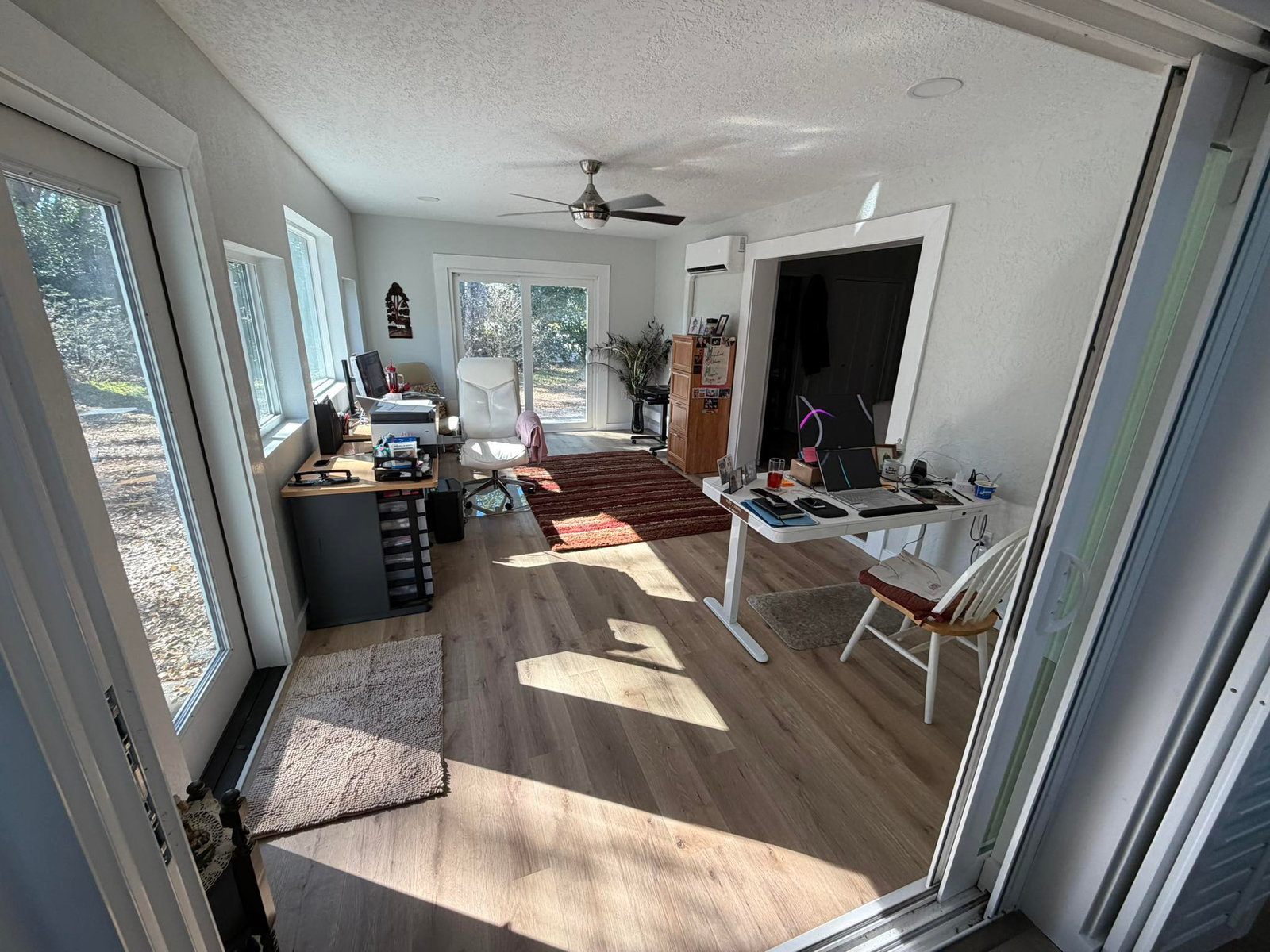 Bright finished sunroom with new sliding doors