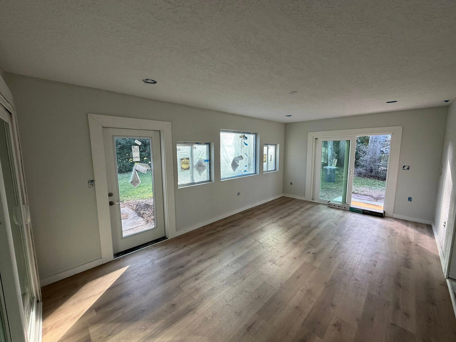 Sunroom conversion with new flooring ready for move-in